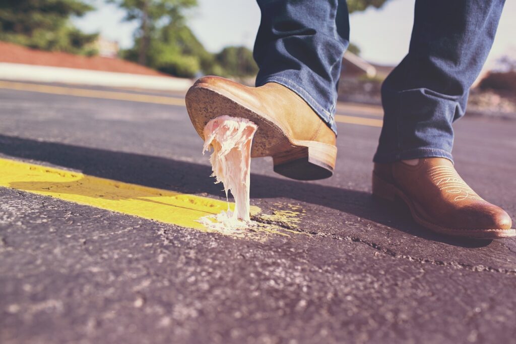 person stepping on gum